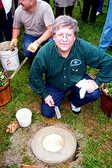 NOAA geodesist Dave Doyle sets the commemorative mark