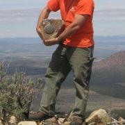 man holding a destroyed mark